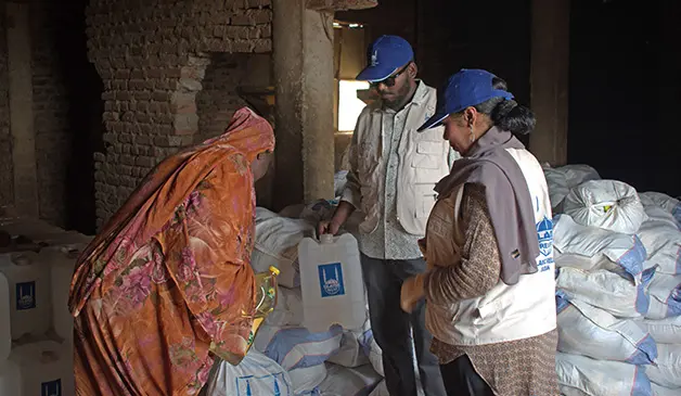 Image: Islamic Relief teams distributing food packs and non-food items.